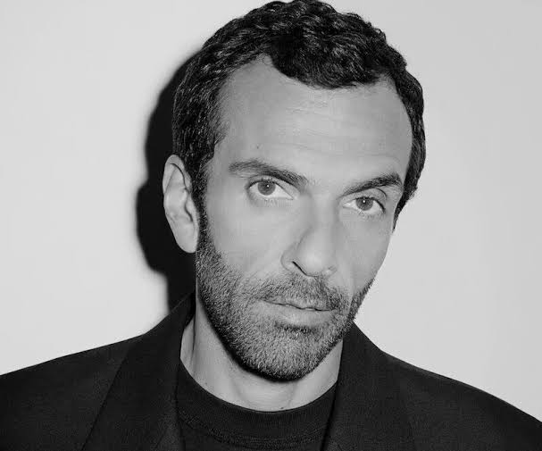 Black and white close portrait of Cédric Charbit against a plain wall