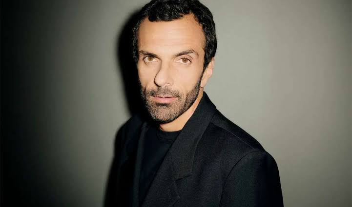 Editorial portrait of Cédric Charbit in a dark jacket against a neutral studio backdrop